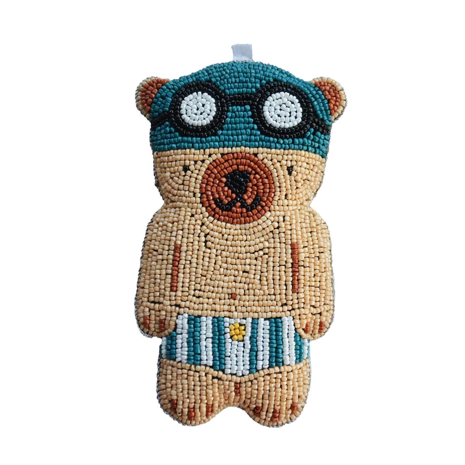 Decorative bear ornament with goggles and striped shorts on a white background